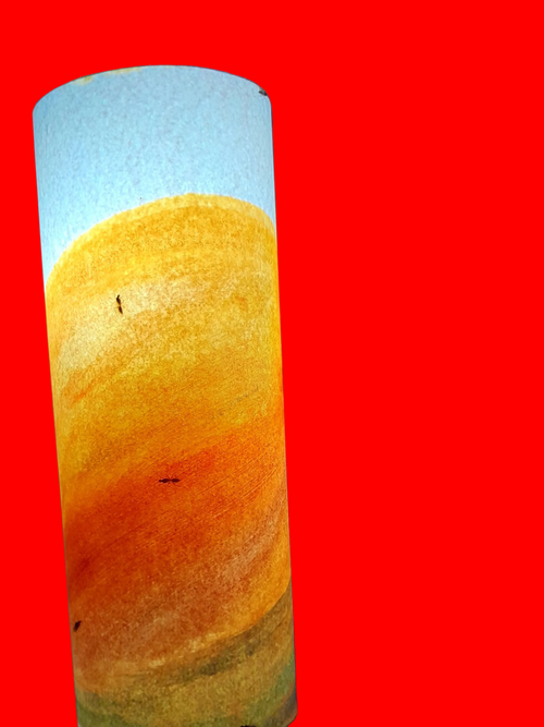 Lamp with a gradient design from white to orange on a blurred background